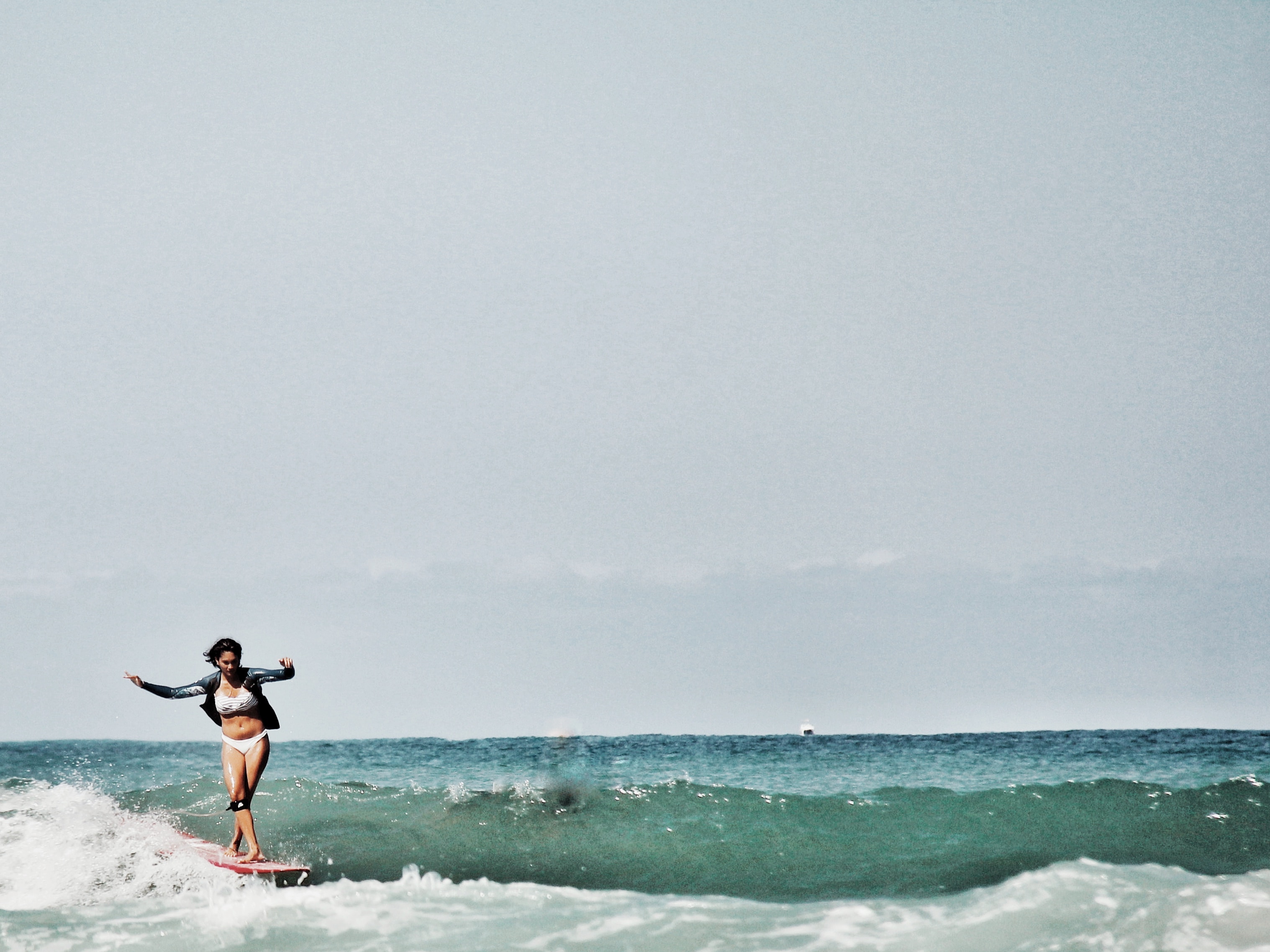 woman surfing in Biarritz